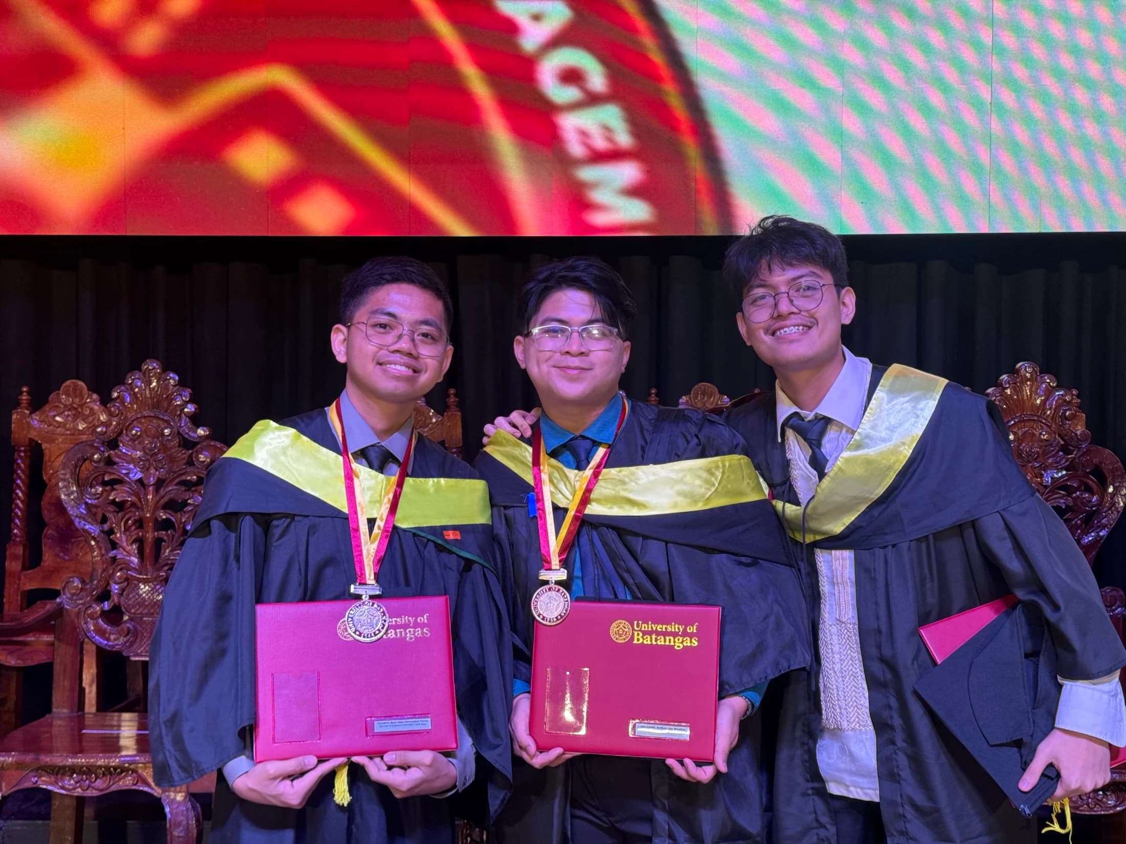 Three graduates together — Auxiliare capstone project