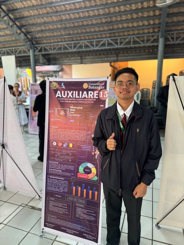 With the Auxiliare poster — Auxiliare capstone project